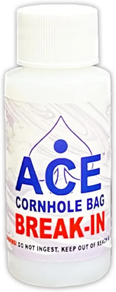 A bottle labeled 'ACE Cornhole Bag Break-In' used to break in cornhole bags, ensuring optimal bag feel and performance. Warning label at the bottom advises not to ingest.