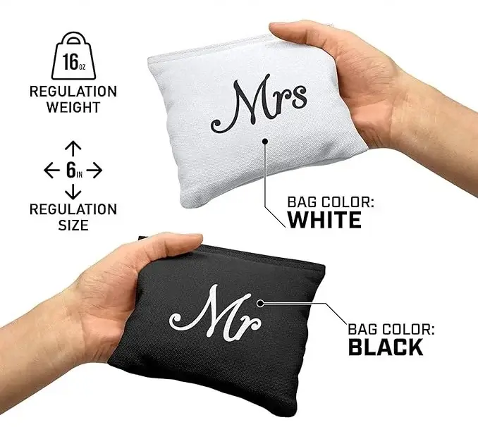 Wedding cornhole bags set with 'Mr' and 'Mrs' designs. These custom cornhole bags are regulation size (6 inches) and weight (16 oz), featuring a black bag with 'Mr' in white text and a white bag with 'Mrs' in black text. Perfect for weddings and personalized cornhole games at celebrations.