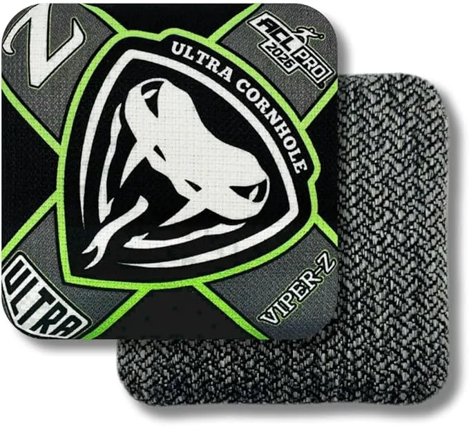 Overlapping front and back views of an Ultra Cornhole "Viper-Z" bag. The graphic side features a black and grey geometric design with neon green accents, a white viper head logo, and an "ACL PRO 2026" stamp, while the partially hidden bag underneath displays a speckled grey woven fabric texture.
