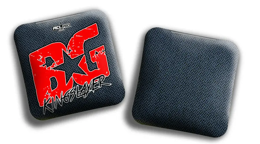 Two BG Kingslayer cornhole bags, one showing the front with a bold red BG Kingslayer logo and ACL Pro 2025 marking, and the other showing the back with a dark hybrid carpet texture.