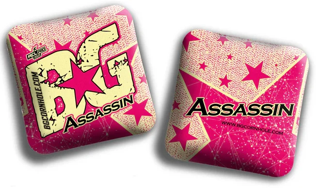 A pair of BG Assassin cornhole bags with a cream and pink color scheme. The front features a bold "BG Assassin" logo with stars, while the back displays the word "Assassin" in large text against a background of interconnected lines and stars.