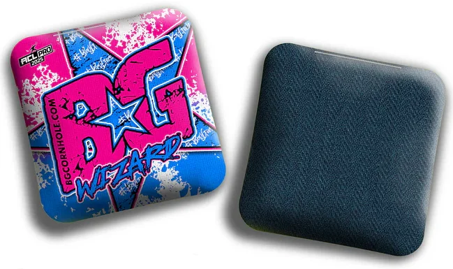 A vibrant BG Wizard cornhole bag featuring a pink and blue design with a star motif and bold "BG Wizard" text on the front. The back side has a textured, dark material designed for enhanced grip and playability. The ACL Pro logo is visible, indicating its professional quality.