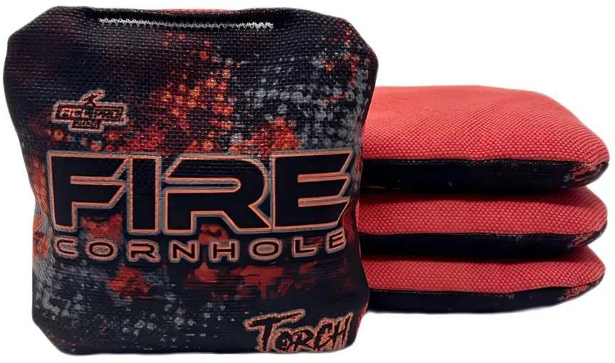 Set of Fire Cornhole bags from the Torch series, featuring a bold red and black flame design. The text 'FIRE CORNHOLE' and 'Torch' is prominently displayed on the bags.