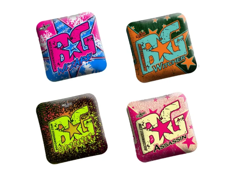 Four different BG Cornhole bags arranged in a square. Top left: a pink, blue, and white 'BG Wizard' bag with a star graphic. Top right: an orange and green 'BG Witcher' bag with stars. Bottom left: a neon green and black 'BG Sorcerer' bag with a splatter effect. Bottom right: a cream and pink 'BG Assassin' bag with star graphics.