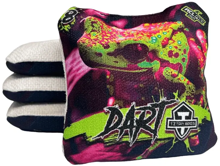 A set of Titan Cornhole bags from the Dart series, featuring a colorful gecko design with vibrant pink, green, and black tones. The text 'DART' is boldly displayed with the Titan Bags logo, along with a speed rating of 8 in the upper left corner, highlighting its quick and responsive play style.