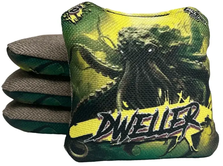 A set of Titan Cornhole bags from the Dweller series, featuring a menacing octopus design with dark green and yellow tones. The text 'DWELLER' is boldly displayed across the bottom, along with a speed rating of 6 in the upper left corner, indicating its balanced performance with reliable control and maneuverability.