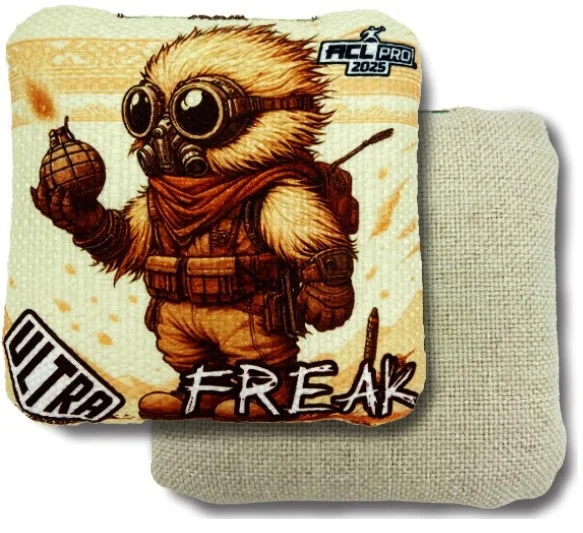 Freak Sand Ultra Cornhole Bag: Featuring a detailed, cartoonish character dressed in a post-apocalyptic gas mask and wielding a grenade, the "Freak" Ultra Cornhole bag brings an adventurous, rugged vibe. The sandy color palette gives this bag a unique and earthy aesthetic. The reverse side is a textured beige fabric, giving players the ability to control their throws with ease, even in challenging conditions.