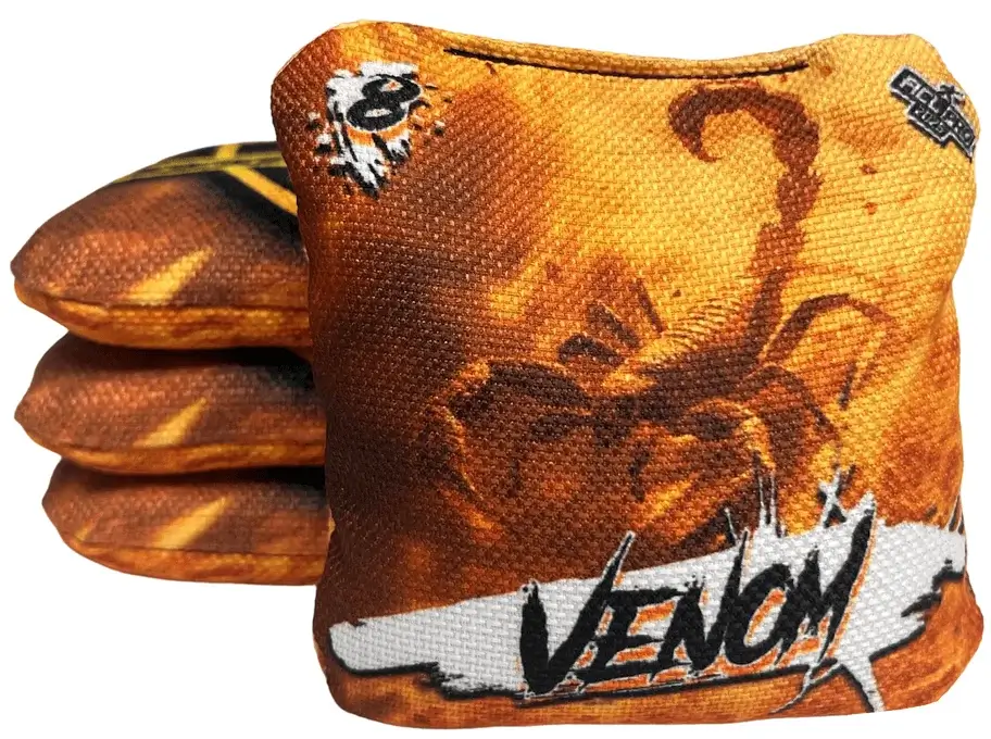 Set of Titan Cornhole bags from the Venom series, featuring a scorpion graphic against a fiery orange background. The text 'VENOM' is prominently displayed, along with a speed rating of 8.