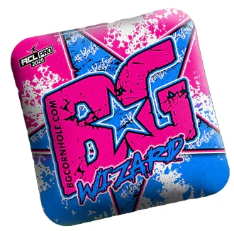 A close-up of a BG Wizard cornhole bag featuring a dynamic pink and blue design with a bold "BG Wizard" logo in the center. The starburst pattern and distressed texture give it a striking, eye-catching look, while the ACL Pro 2025 logo in the top corner confirms its pro-level quality.