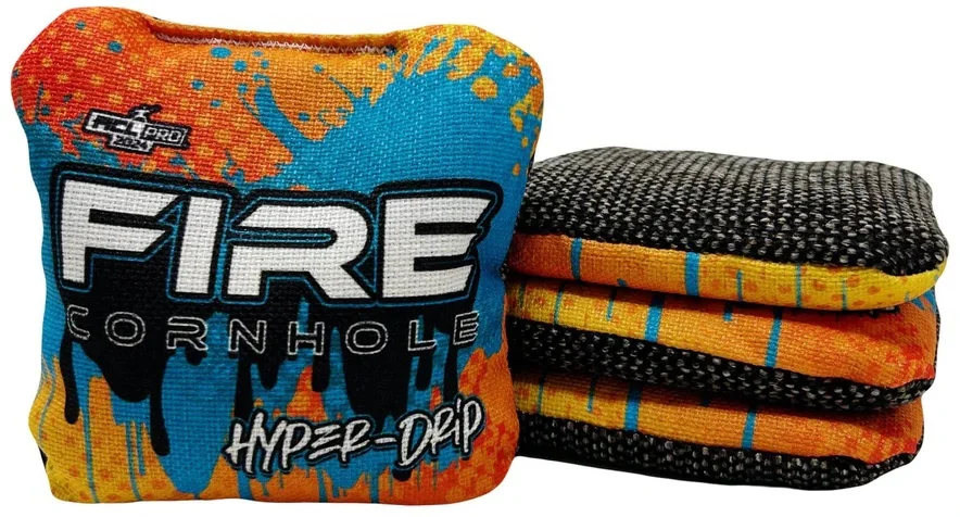 Set of Fire Cornhole bags from the Hyper-Drip series, featuring a vibrant orange, blue, and yellow drip design. The text 'FIRE CORNHOLE' and 'Hyper-Drip' is prominently displayed on the bags.