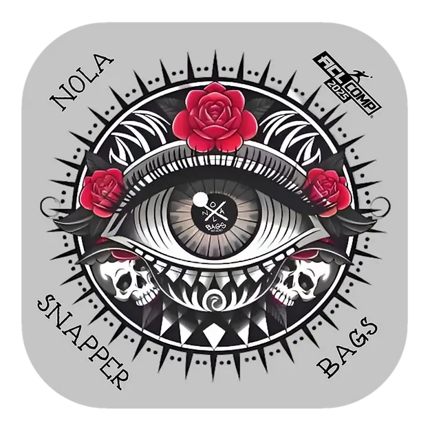 A striking cornhole bag design from NOLA Bags, named "Snapper," featuring a tattoo-style illustration of a large eye with red roses, skulls, and geometric patterns on a gray background. The "ACL Comp 2025" logo and "NOLA Snapper Bags" branding are included.