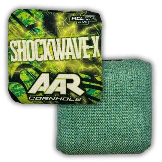AAR Cornhole Shockwave-X ACL Pro 2026 cornhole bags showing both sides: one with a neon green lightning design and bold white branding, the other with a teal and green herringbone textured fabric.