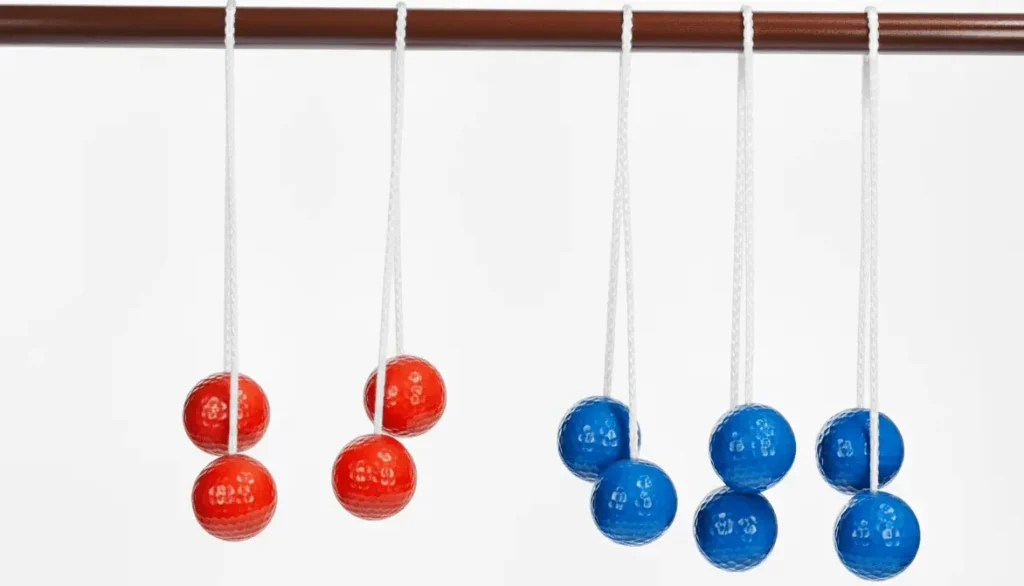 Ladder ball bolas product shot, six bolas displayed with three red and three blue golf balls connected by nylon rope, 13 inch spacing between balls, white background, commercial product photography