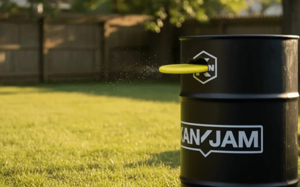 Close up of flying disc entering Kan Jam goal slot for instant win, dramatic scoring moment, black goal container detail, outdoor game victory capture