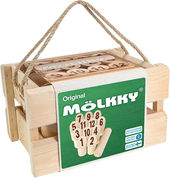 A wooden crate containing the Mölkky game. The crate has a green label with the "Original Mölkky" logo, showing some of the numbered wooden pins and the throwing skittle.