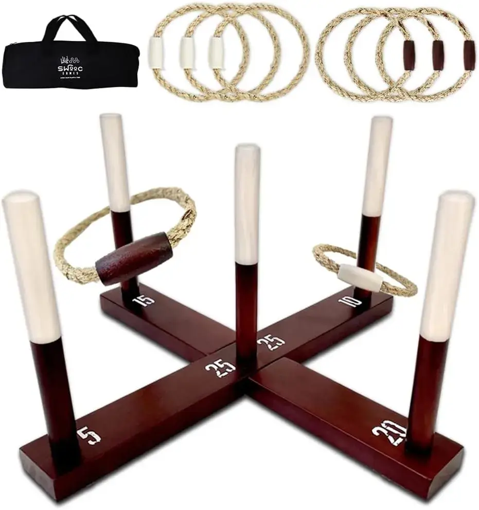 A wooden ring toss game set up with five dark wood posts on a cross-shaped base, each with a different score number (5, 10, 15, 20, 25). Two rope rings are on two of the posts. Above the main game, there's a black carrying bag and several additional rope rings.